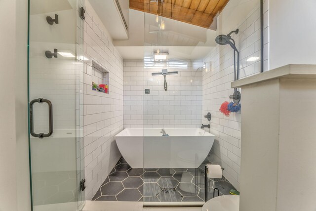 1301 W Morton Dr, Dalton, GA 30720 - bathroom featuring tile walls, a stall shower, tile patterned floors, and a soaking tub