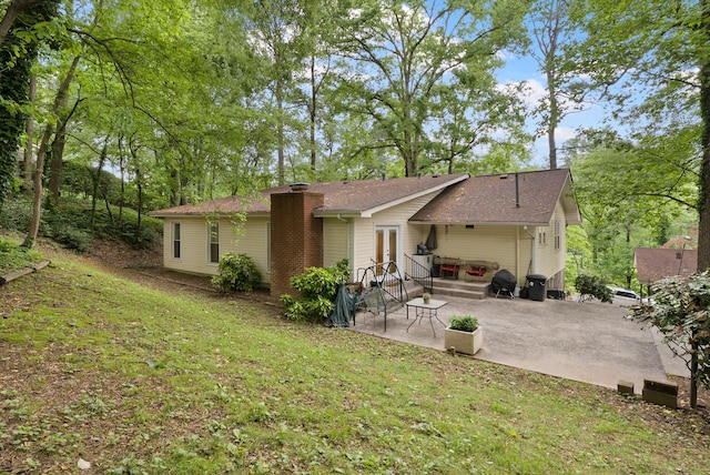 1123 Ridgeleigh Cir, Dalton, GA 30720 - rear view of house with a chimney, a patio area, french doors, a lawn, and a shingled roof
