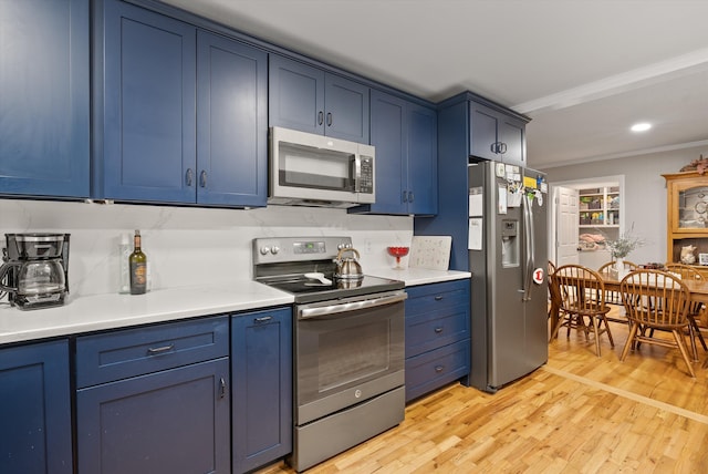 1123 Ridgeleigh Cir, Dalton, GA 30720 - kitchen featuring stainless steel appliances, blue cabinets, recessed lighting, and ornamental molding
