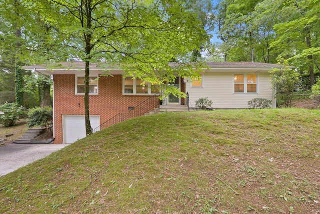 1123 Ridgeleigh Cir, Dalton, GA 30720 - view of front of home featuring a garage, concrete driveway, a front lawn, and brick siding