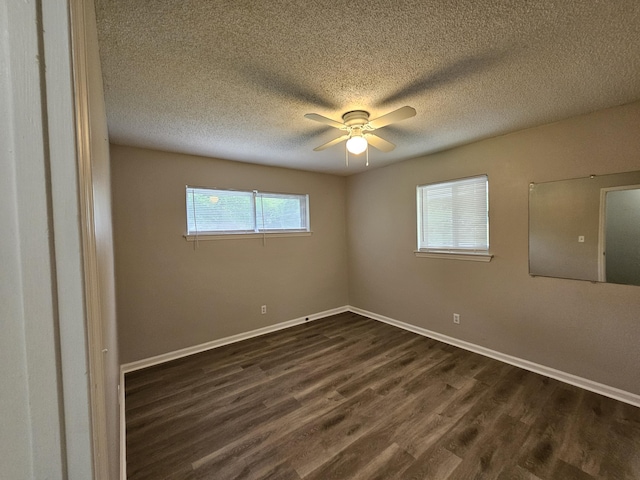 4458 Norcross Rd, Hixson, TN 37343 - unfurnished room featuring dark wood-type flooring, ceiling fan, a textured ceiling, and baseboards