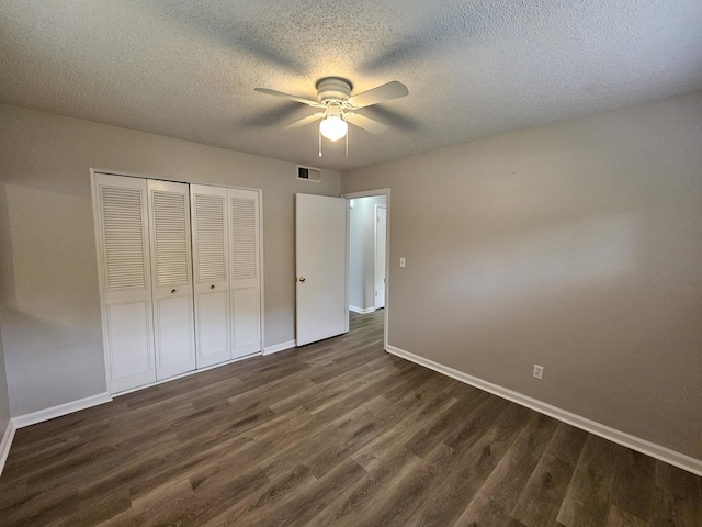 4458 Norcross Rd, Hixson, TN 37343 - unfurnished bedroom with dark wood-style floors, baseboards, a closet, a textured ceiling, and a ceiling fan