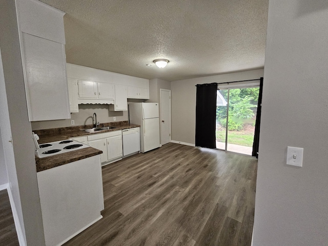 4458 Norcross Rd, Hixson, TN 37343 - kitchen featuring a sink, white appliances, dark countertops, dark wood-type flooring, and white cabinets
