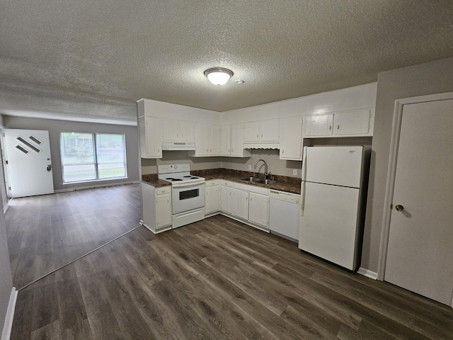 4458 Norcross Rd, Hixson, TN 37343 - kitchen with white appliances, a sink, dark countertops, under cabinet range hood, and a textured ceiling