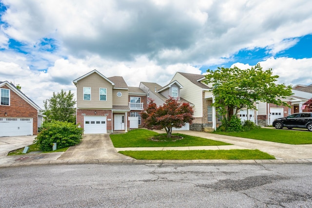 7817 Legacy Park Ct, Chattanooga, TN 37421 - view of property featuring brick siding, driveway, a front yard, and a residential view