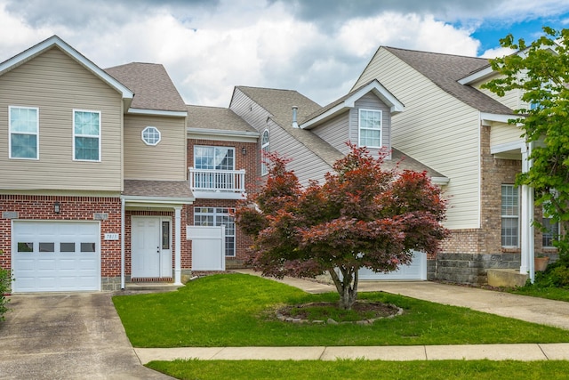 7817 Legacy Park Ct, Chattanooga, TN 37421 - view of property featuring driveway, brick siding, a shingled roof, and a front lawn