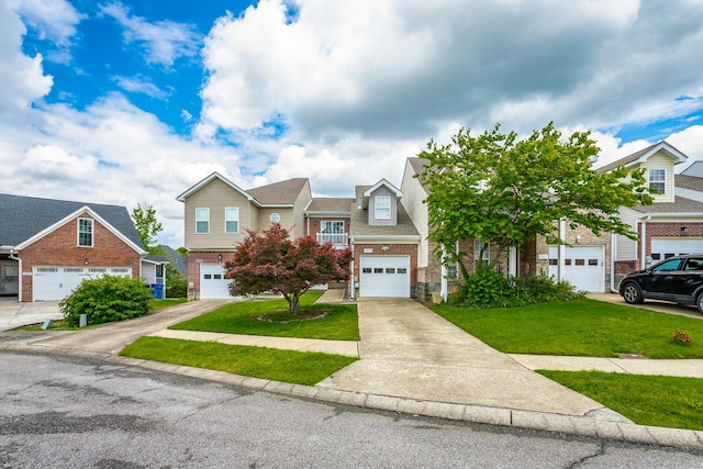 7817 Legacy Park Ct, Chattanooga, TN 37421 - view of front facade featuring brick siding, a front yard, concrete driveway, and a residential view
