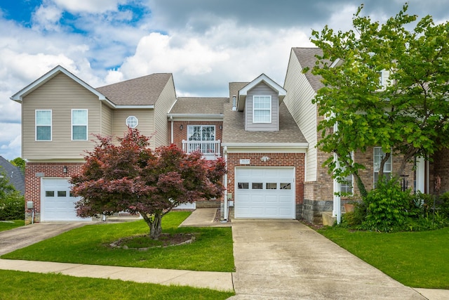 7817 Legacy Park Ct, Chattanooga, TN 37421 - view of front of house with an attached garage, driveway, brick siding, and a front yard