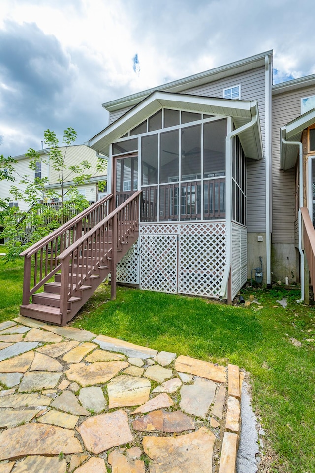 7817 Legacy Park Ct, Chattanooga, TN 37421 - back of house with a sunroom, stairs, and a lawn