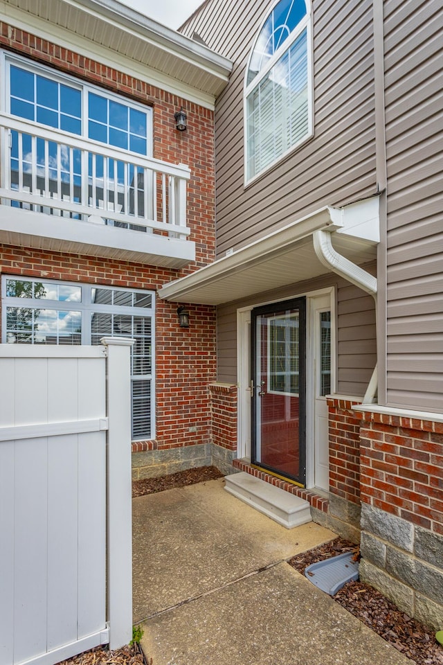 7817 Legacy Park Ct, Chattanooga, TN 37421 - doorway to property with brick siding and a balcony
