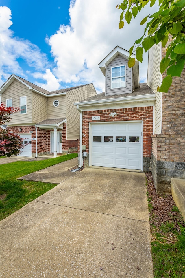 7817 Legacy Park Ct, Chattanooga, TN 37421 - view of front of home featuring brick siding, driveway, and an attached garage