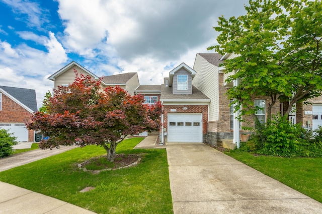 7817 Legacy Park Ct, Chattanooga, TN 37421 - view of front of home with concrete driveway, a front lawn, an attached garage, and roof with shingles