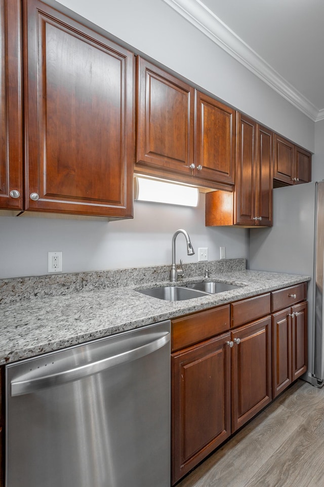 7817 Legacy Park Ct, Chattanooga, TN 37421 - kitchen with stainless steel dishwasher, a sink, crown molding, light wood finished floors, and light stone countertops