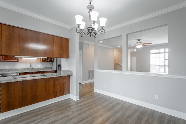 7817 Legacy Park Ct, Chattanooga, TN 37421 - kitchen with a sink, wood finished floors, baseboards, a ceiling fan, and light stone countertops