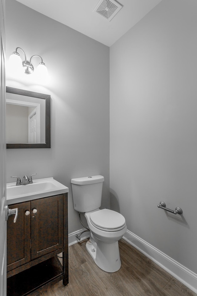 7817 Legacy Park Ct, Chattanooga, TN 37421 - half bath with wood finished floors, baseboards, toilet, and vanity
