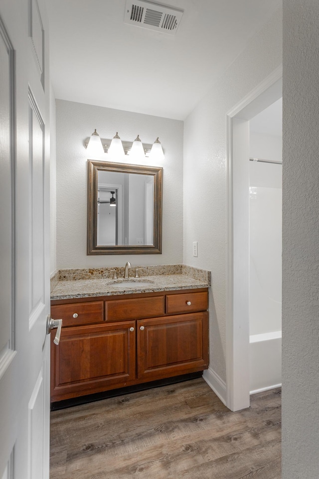 7817 Legacy Park Ct, Chattanooga, TN 37421 - bathroom with wood finished floors and vanity