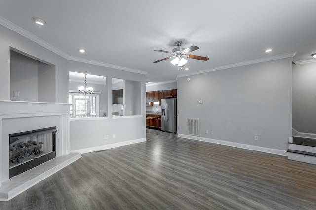 7817 Legacy Park Ct, Chattanooga, TN 37421 - unfurnished living room featuring ceiling fan, dark wood-style flooring, a tiled fireplace, recessed lighting, and ornamental molding