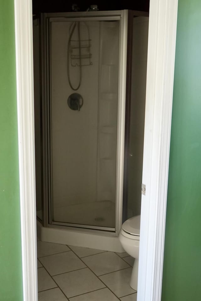 708 8th St, Bridgeport, AL 35740 - full bathroom featuring tile patterned flooring, a shower stall, and toilet