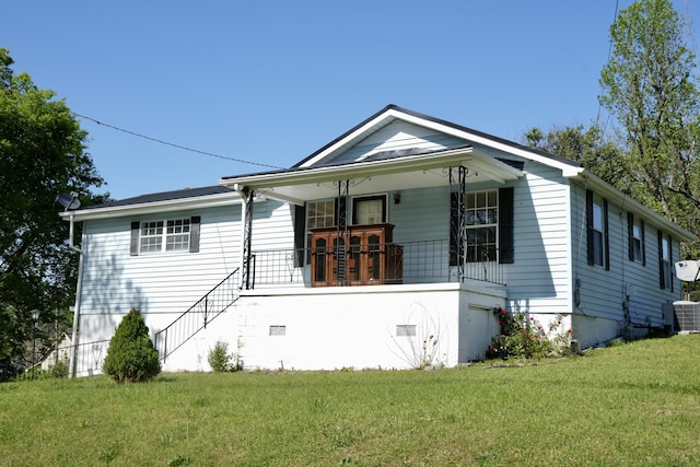 708 8th St, Bridgeport, AL 35740 - bungalow featuring a porch, a front yard, and central AC