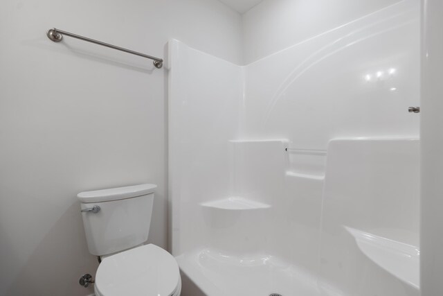 full bathroom with a shower and toilet