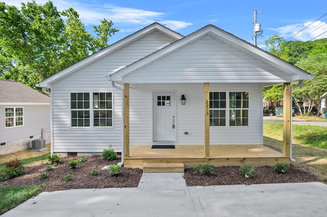 bungalow-style house with central AC unit and a porch