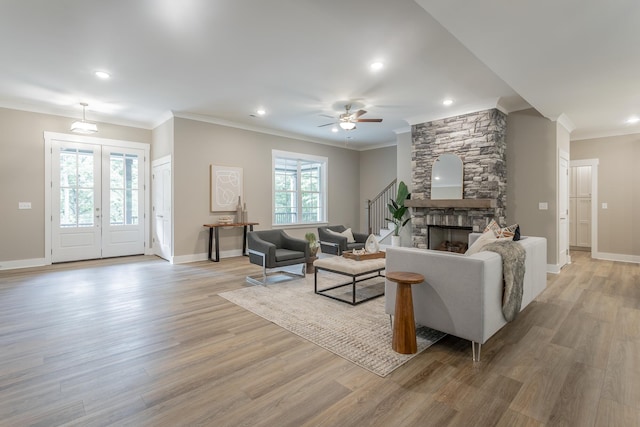 11570 Armstrong Rd, Soddy Daisy, TN 37379 - living room with light wood-type flooring, ornamental molding, baseboards, ceiling fan, and stairway