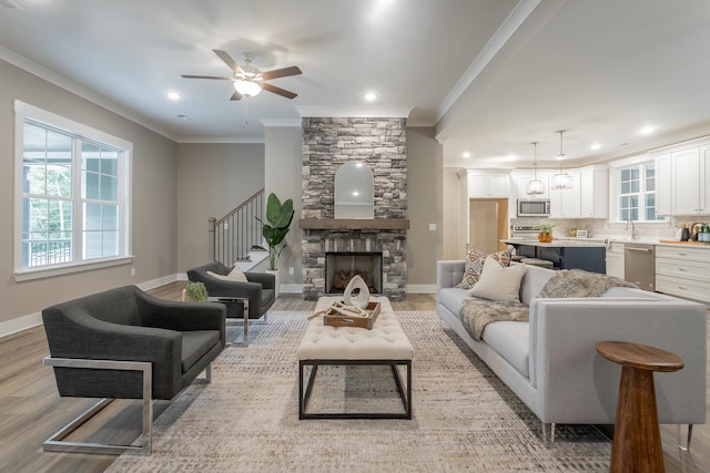 11570 Armstrong Rd, Soddy Daisy, TN 37379 - living area with light wood-style flooring, ornamental molding, ceiling fan, healthy amount of natural light, and baseboards