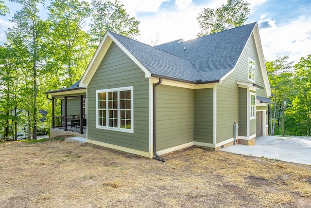 11570 Armstrong Rd, Soddy Daisy, TN 37379 - view of property exterior with a shingled roof and concrete driveway