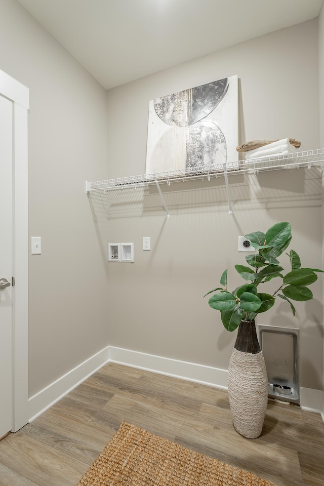 11570 Armstrong Rd, Soddy Daisy, TN 37379 - laundry room featuring hookup for an electric dryer, wood finished floors, washer hookup, and baseboards