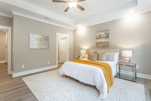 11570 Armstrong Rd, Soddy Daisy, TN 37379 - bedroom featuring crown molding, wood finished floors, baseboards, a tray ceiling, and recessed lighting