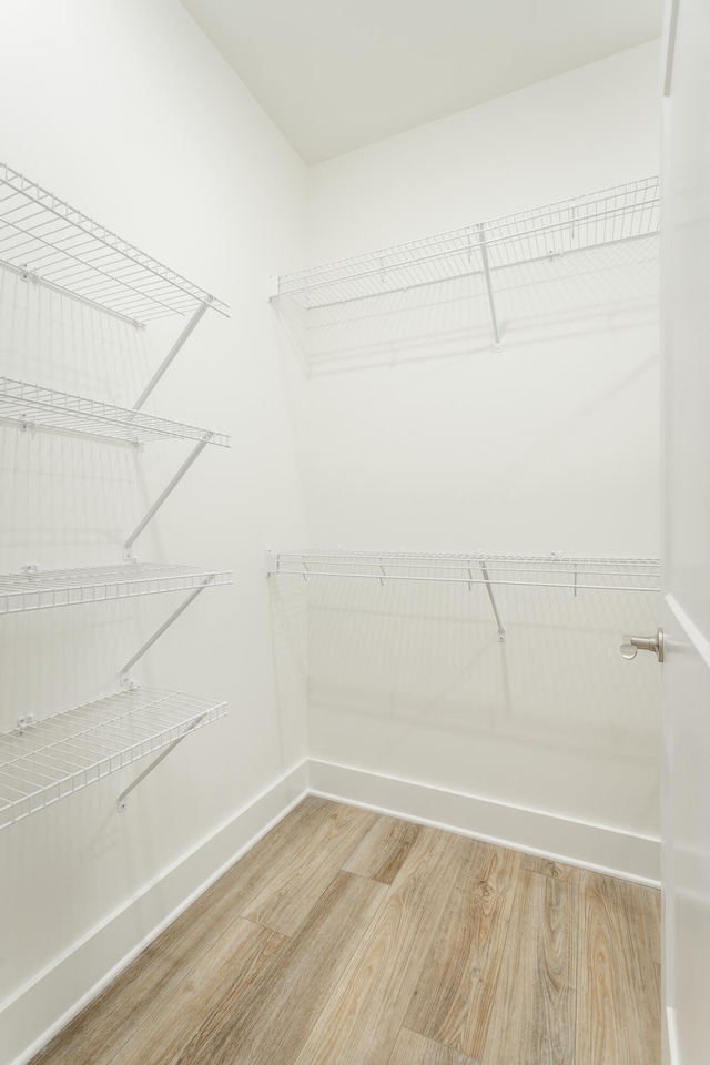 11570 Armstrong Rd, Soddy Daisy, TN 37379 - walk in closet featuring light wood finished floors