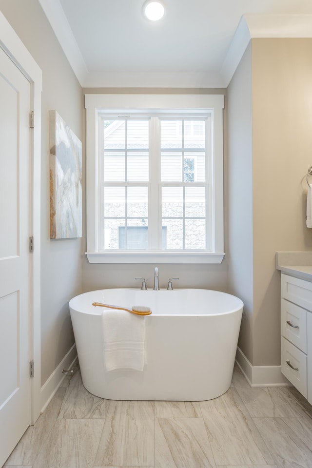 11570 Armstrong Rd, Soddy Daisy, TN 37379 - bathroom with marble look tiles, a soaking tub, vanity, and baseboards