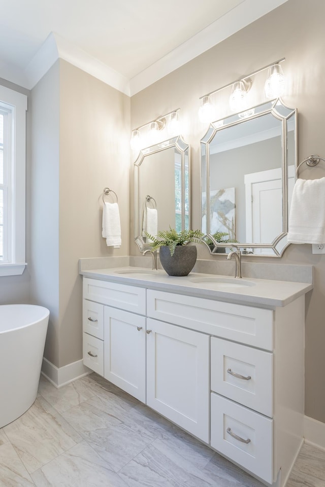 11570 Armstrong Rd, Soddy Daisy, TN 37379 - bathroom with double vanity, ornamental molding, a soaking tub, and marble look tiles