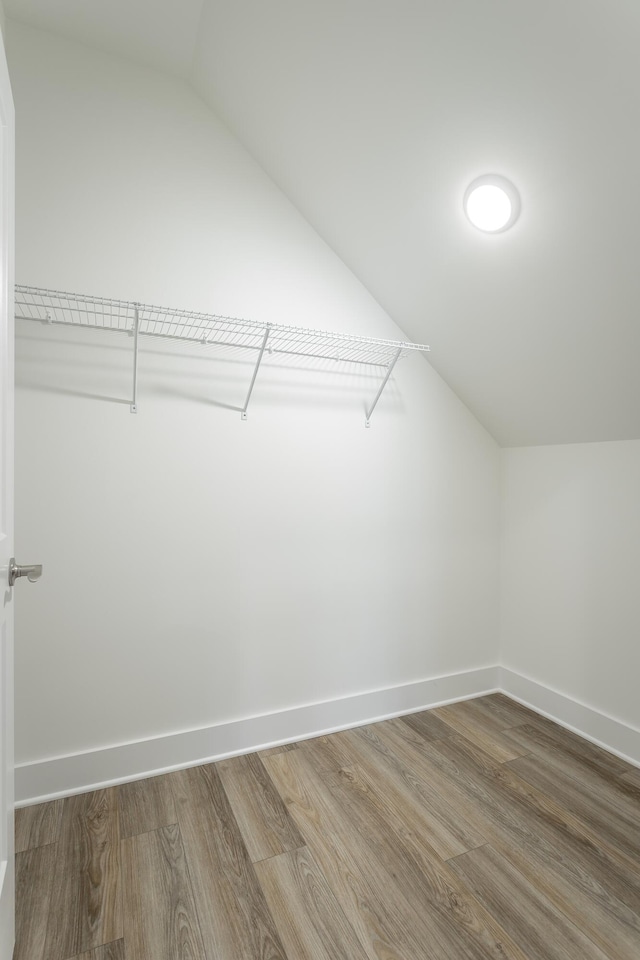 11570 Armstrong Rd, Soddy Daisy, TN 37379 - spacious closet featuring vaulted ceiling and wood finished floors