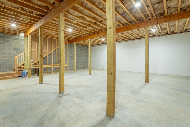 11570 Armstrong Rd, Soddy Daisy, TN 37379 - unfinished basement with stairway and concrete block wall