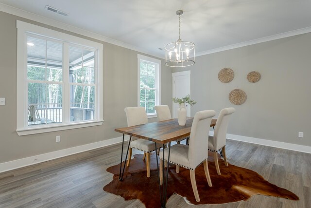 11570 Armstrong Rd, Soddy Daisy, TN 37379 - dining space with a chandelier, healthy amount of natural light, crown molding, and wood finished floors