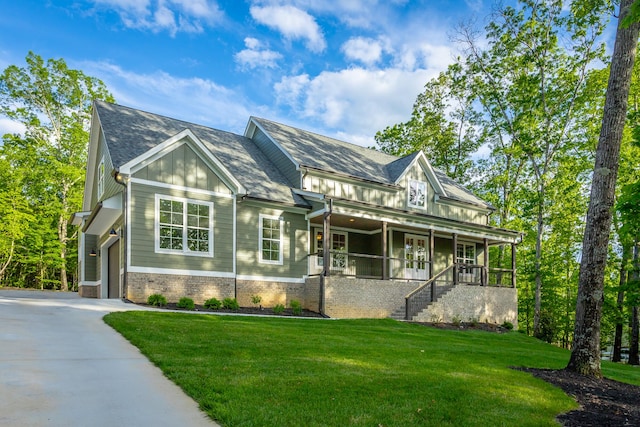 11570 Armstrong Rd, Soddy Daisy, TN 37379 - view of front facade featuring a front lawn, stairway, board and batten siding, driveway, and a porch