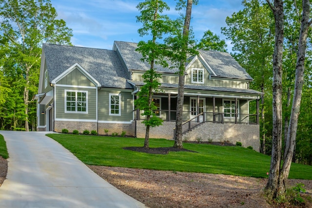 11570 Armstrong Rd, Soddy Daisy, TN 37379 - view of front of house with a porch, a front yard, board and batten siding, driveway, and stairs