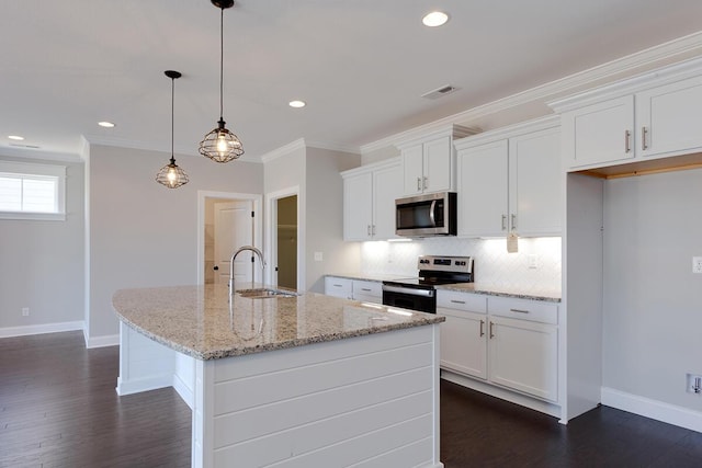 kitchen with stainless steel appliances, a sink, backsplash, baseboards, and crown molding