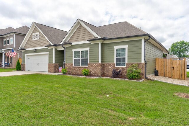 231 Winchester Dr, Rossville, GA 30741 - craftsman inspired home with brick siding, driveway, an attached garage, and a shingled roof