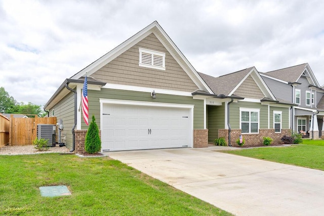 231 Winchester Dr, Rossville, GA 30741 - craftsman-style house with central AC unit, brick siding, driveway, and an attached garage