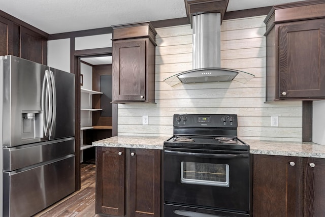 201 County Line Rd, Signal Mountain, TN 37377 - kitchen featuring stainless steel refrigerator with ice dispenser, black electric range, wall chimney exhaust hood, dark brown cabinets, and wood walls