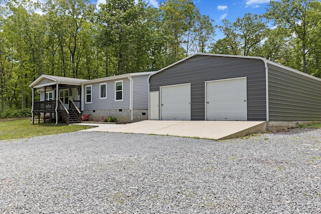 201 County Line Rd, Signal Mountain, TN 37377 - view of front of home with crawl space, covered porch, an outdoor structure, and a garage