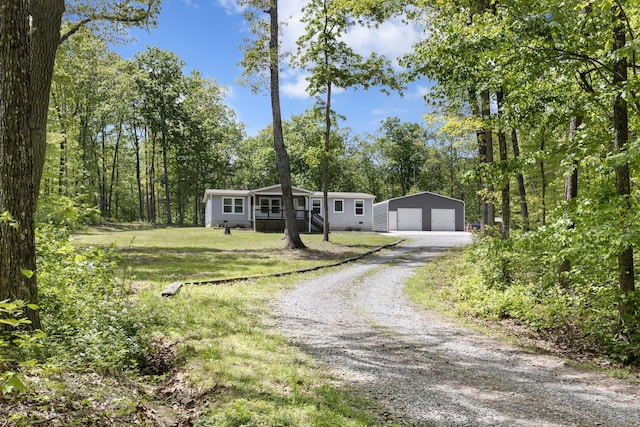 201 County Line Rd, Signal Mountain, TN 37377 - manufactured / mobile home with a garage, an outdoor structure, a front yard, and gravel driveway