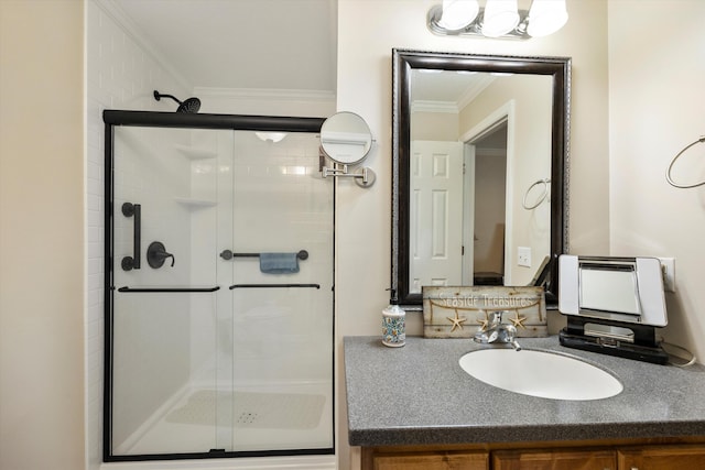 full bathroom with crown molding, a stall shower, and vanity