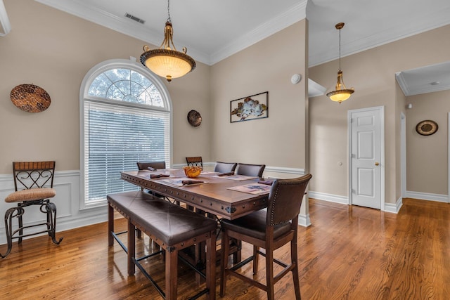 2123 Sargent Quick Dr, Chattanooga, TN 37421 - dining area featuring ornamental molding, light wood finished floors, and wainscoting