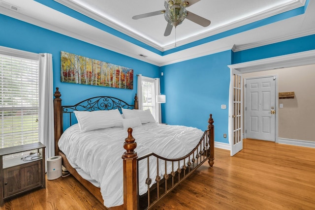 2123 Sargent Quick Dr, Chattanooga, TN 37421 - bedroom with wood finished floors, ornamental molding, a tray ceiling, and a ceiling fan