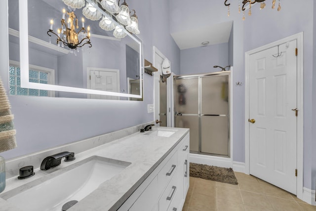 2123 Sargent Quick Dr, Chattanooga, TN 37421 - bathroom with a chandelier, a stall shower, tile patterned floors, and double vanity