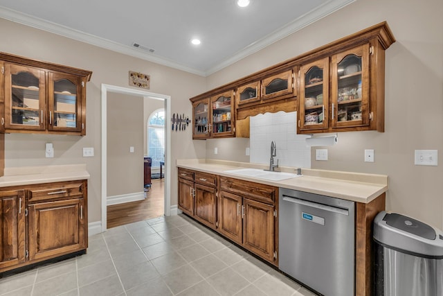 2123 Sargent Quick Dr, Chattanooga, TN 37421 - kitchen featuring dishwasher, light countertops, light tile patterned flooring, ornamental molding, and glass insert cabinets