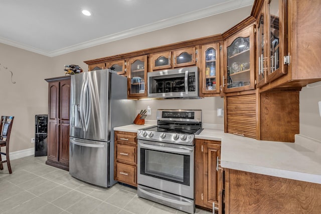 2123 Sargent Quick Dr, Chattanooga, TN 37421 - kitchen with appliances with stainless steel finishes, brown cabinets, crown molding, light countertops, and recessed lighting